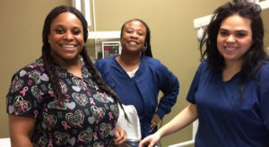 Three Dental Assistants and dental chair